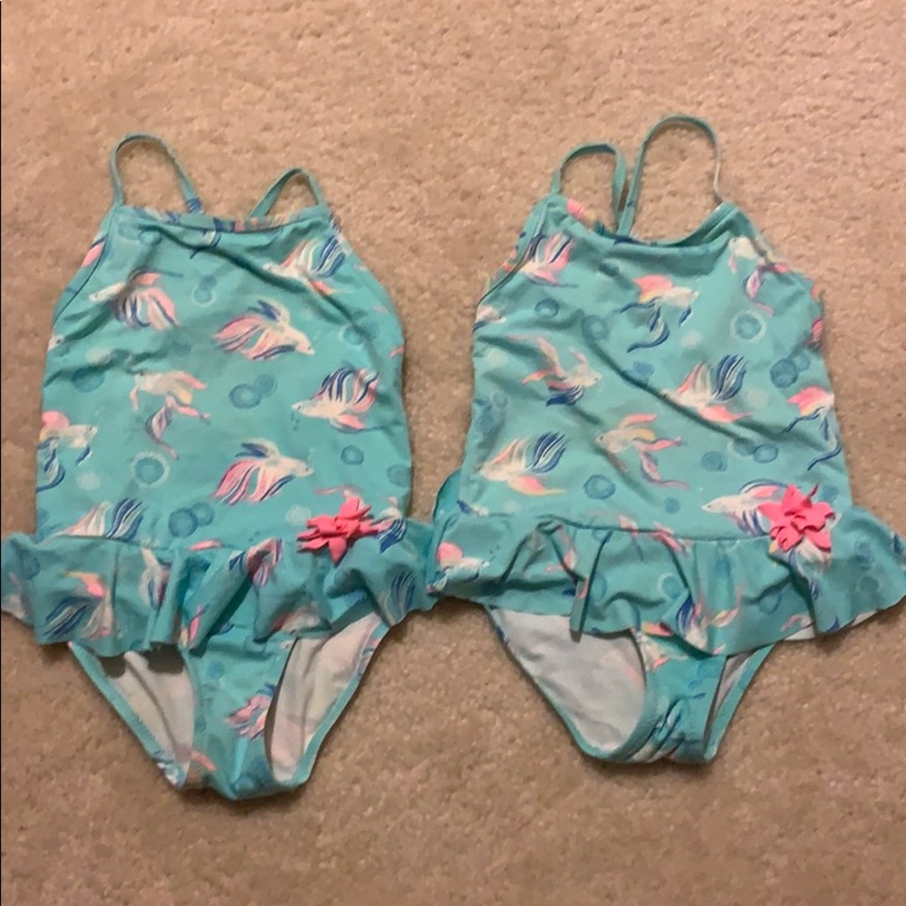 Twin girls bathing suits with rainbow beta fish
